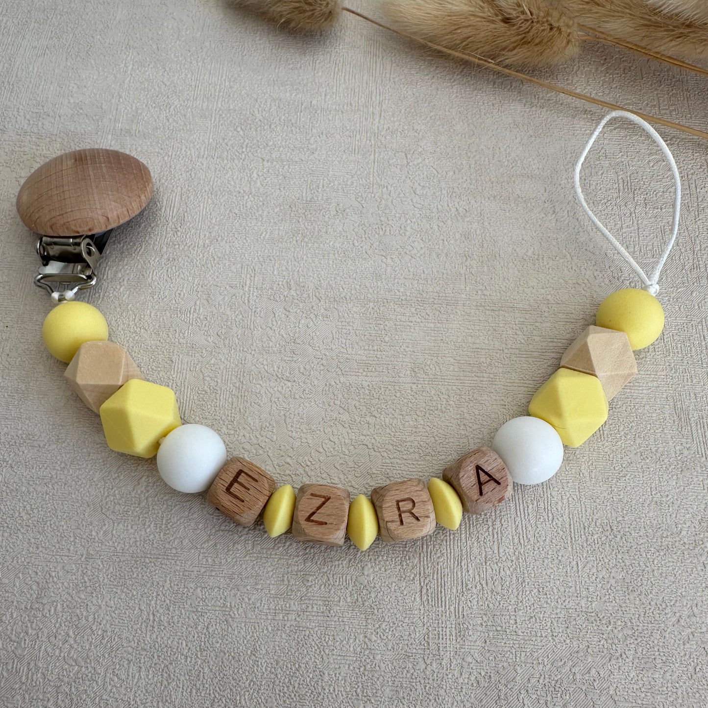 Attache tétine jaune & blanc