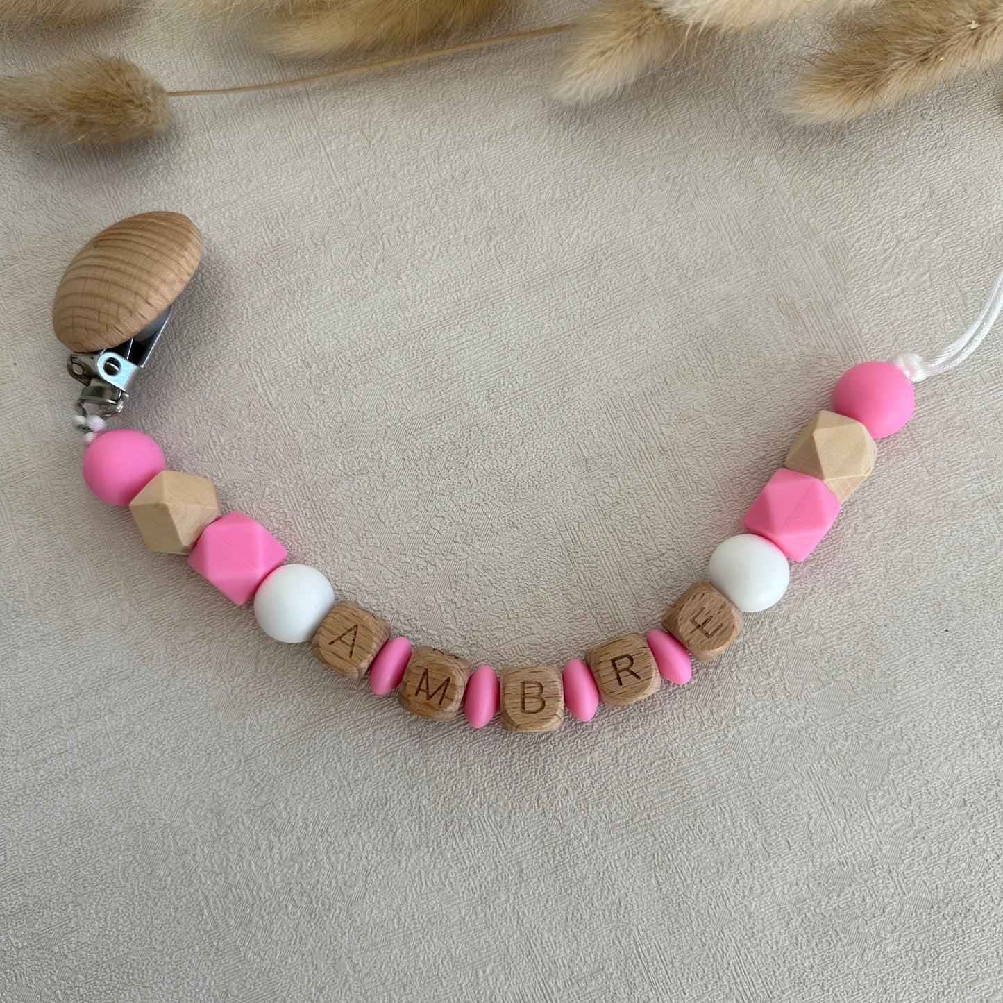 Attache tétine rose fluo & blanc