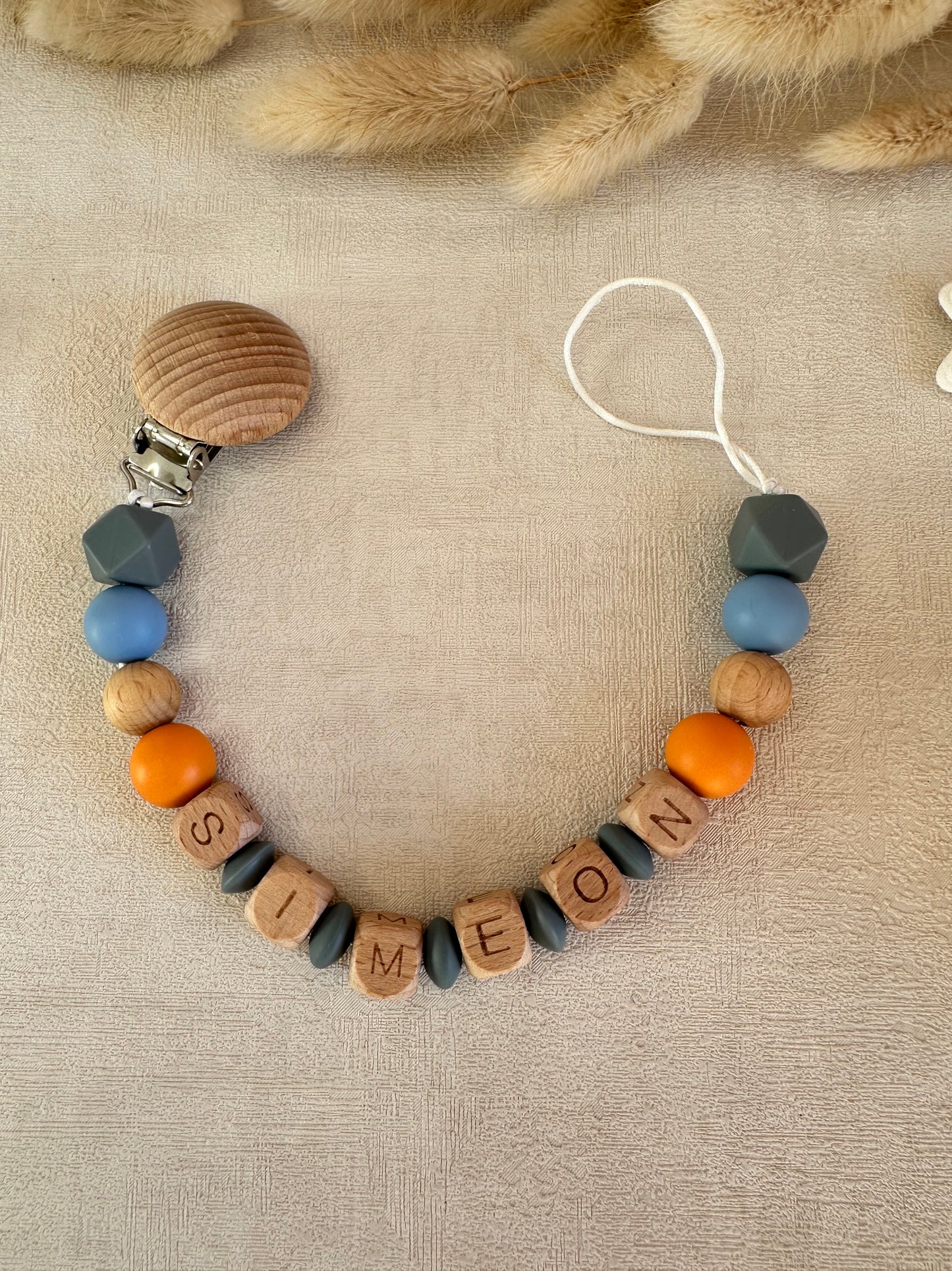 Attache tétine gris, bleu & orange