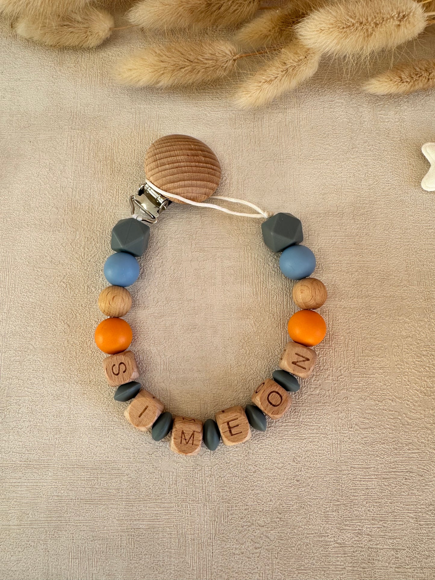 Attache tétine gris, bleu & orange
